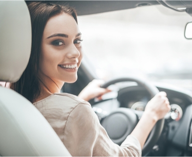 Happy woman getting a new car with Union Plus Auto Buying Service Happy woman getting a new car with Union Plus Auto Buying Service