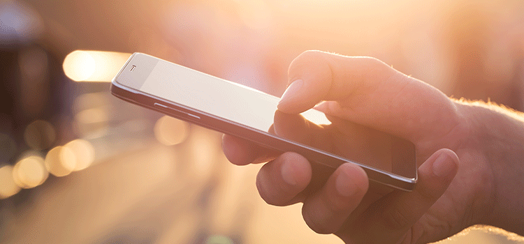 Holding a mobile phone in hand
